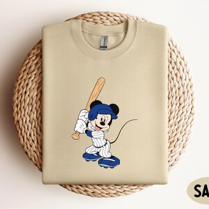 a t - shirt with a cartoon baseball player on it