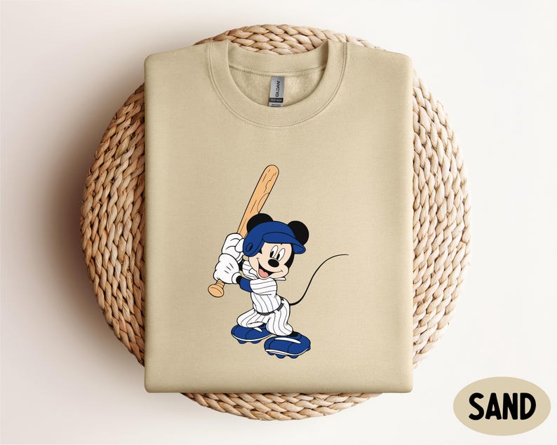 a t - shirt with a cartoon baseball player on it
