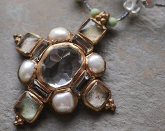 Clear quartz, freshwater pearls and textured glass cabochons, cross-shaped pendant (N-5111)