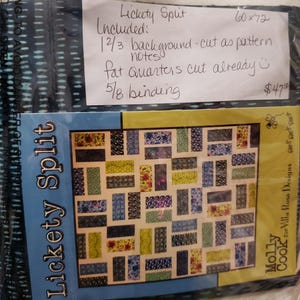 May include: A Lickety Split quilt pattern kit by Molly Cook for Villa Rosa Designs. The packaging features a rectangular quilt design with multi-colored floral and geometric fabric blocks. A handwritten note lists contents including background fabric, fat quarters, and binding.