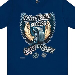 May include: A navy blue t-shirt with a graphic of a tire with wings and the text "Driven Toward Success Guided By Passion". The graphic also includes two smaller circles with the text "Rolling Through Anything In The Way" and "No Speed Limit".
