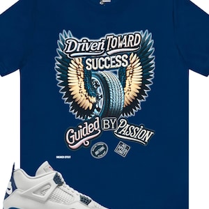 May include: A pair of white and grey sneakers with blue accents. The sneakers have a gum sole and are sitting on a blue t-shirt with a graphic of a tire with wings and the text "Driven Toward Success Guided By Passion".