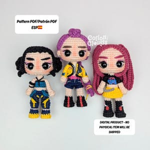 May include: Three crocheted dolls with distinctive hairstyles and outfits. The dolls have black, purple, and pink hair, and wear colourful clothing. The image includes text that says "Pattern PDF" and "Digital Product - No Physical Item Will Be Shipped."