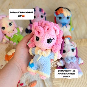 May include: A collection of colorful, crocheted pony dolls. The central doll is pink with a blue outfit. Other dolls include a purple pony, a blue pony with a rainbow mane, and a white unicorn. The image includes text that says "Pattern PDF" and "Digital Product - No Physical Item Will Be Shipped."