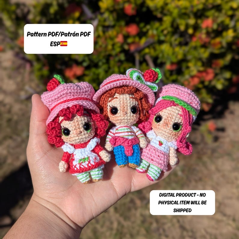 May include: Three crocheted dolls in the image, each with a strawberry theme. The dolls have pink hats, red hair, and are wearing dresses. The text in the image says "Pattern PDF/Patr&oacute;n PDF ESP" and "DIGITAL PRODUCT - NO PHYSICAL ITEM WILL BE SHIPPED."