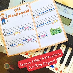 May include: Two sheets of music for children with the title "Old MacDonald for kids." The sheets feature musical notes, colorful shapes, and illustrations of a farmer and farm animals. The text "Easy to follow instructions for little fingers!" is also visible.