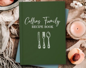 May include: A green recipe book with the text "Collins Family RECIPE BOOK" in white script. The book has a white illustration of a knife, fork, and spoon.