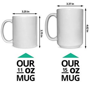 May include: Two white ceramic mugs with black text. The smaller mug is 11 ounces and the larger mug is 15 ounces. Both mugs have a green arrow pointing upwards above the text.
