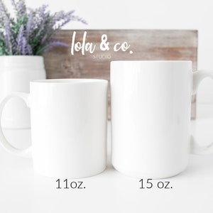 May include: Two white ceramic mugs, one 11 oz and one 15 oz, on a white surface. The mugs are blank and ready for personalisation.