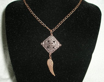 SALE.. Copper Colored Square with Wing Necklace ..