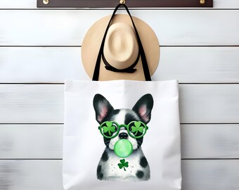 May include: White tote bag with a black and white French bulldog wearing green shamrock sunglasses and blowing a green bubble. The dog has a shamrock on its chest.