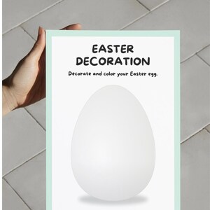 May include: A rectangular sign with a light green border and the words "EASTER DECORATION" in bold black letters. Below the title is the text "Decorate and color your Easter egg." A large white egg shape is in the center of the sign.