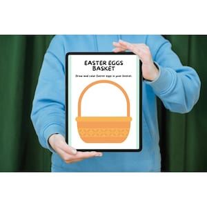 May include: A tablet displays an Easter-themed coloring page. The page features an orange basket with a handle, and the text "EASTER EGGS BASKET" above the image. Below the image, the text reads, "Draw and color Easter eggs in your basket."