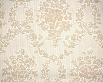May include: Wallpaper featuring a repeating pattern of beige floral bouquets and swags set against a cream-colored background with fine vertical pinstripes. The design includes embossed flower clusters and ribbon-like elements in a light tan hue.