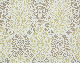 May include: Cream-colored wallpaper with a repeating pattern of stylized floral and foliate motifs in shades of tan and gold. The design includes symmetrical arrangements of flowers, leaves, and decorative swirls, creating a classic, elegant look.