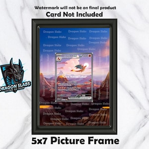 May include: A black 5x7 picture frame displaying a Charizard EX trading card. The card is set against a landscape background. The frame has the text "Dragon Slabs" and "Card Not Included".