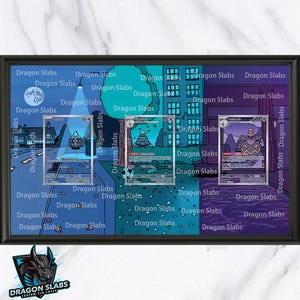 May include: A framed display featuring three trading cards, each encased in a protective sleeve. The background is a stylized blue and purple cityscape with the text "Dragon Slabs" repeated throughout. The frame is black.