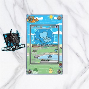 May include: A clear acrylic case with a Pokemon trading card featuring a blue Mew character. The case has a blue and green border with the text "Dragon Slabs" and a dragon logo. The card reads "Mew GX 180".