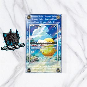 May include: A clear acrylic case containing a trading card. The card shows a yellow character with Japanese text and the number 20. The case is labelled with the text "Dragon Slabs".