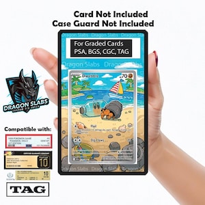 May include: A clear protective case for graded cards, with the text "For Graded Cards PSA, BGS, CGC, TAG." The case is held by a person. The image includes a Pokemon card with a beach scene.