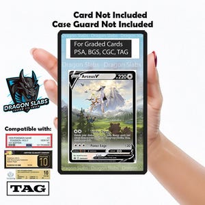 May include: A black card holder with the text "Dragon Slabs" and "For Graded Cards PSA, BGS, CGC, TAG". The holder contains a Pokémon card with an Arceus V illustration. Compatible with PSA, BGS, CGC, and TAG.