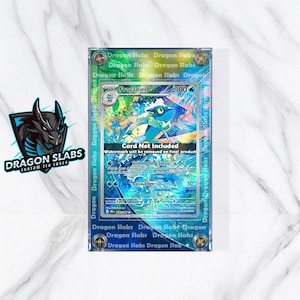 May include: A clear acrylic case with a Pokemon trading card inside. The card features a blue and white Frogradier character with the text "Card Not Included". The case has the text "Dragon Slabs" printed on it.