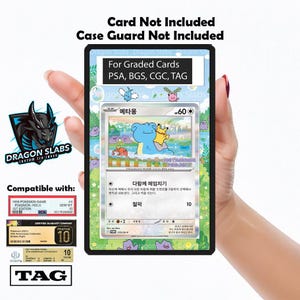 May include: A black Dragon Slabs case for graded cards, compatible with PSA, BGS, CGC, and TAG. The case features a Pokemon card with a blue creature and a yellow creature. The text "For Graded Cards" is visible.
