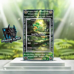 May include: A clear acrylic case containing a Pokemon trading card. The card features a green and yellow Pansage character. The case has the words "Dragon Slabs" printed on the sides. The text "Card Not Included" is also visible.
