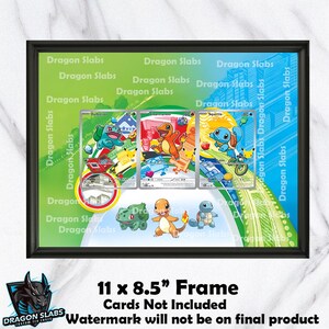 May include: Black framed display featuring three Pokémon trading cards. The frame is 11 x 8.5 inches. The cards feature Bulbasaur, Charmander, and Squirtle. The background is green with the text "Dragon Slabs".