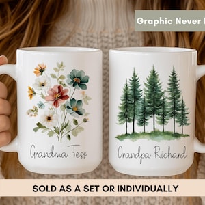 Peut inclure: Deux mugs en céramique blanche. L'un présente un motif floral avec le texte "Grandma Tess". L'autre mug a une scène de forêt avec le texte "Grandpa Richard". Le texte "Graphic Never Fade" est en haut et "SOLD AS A SET OR INDIVIDUALLY" en bas.