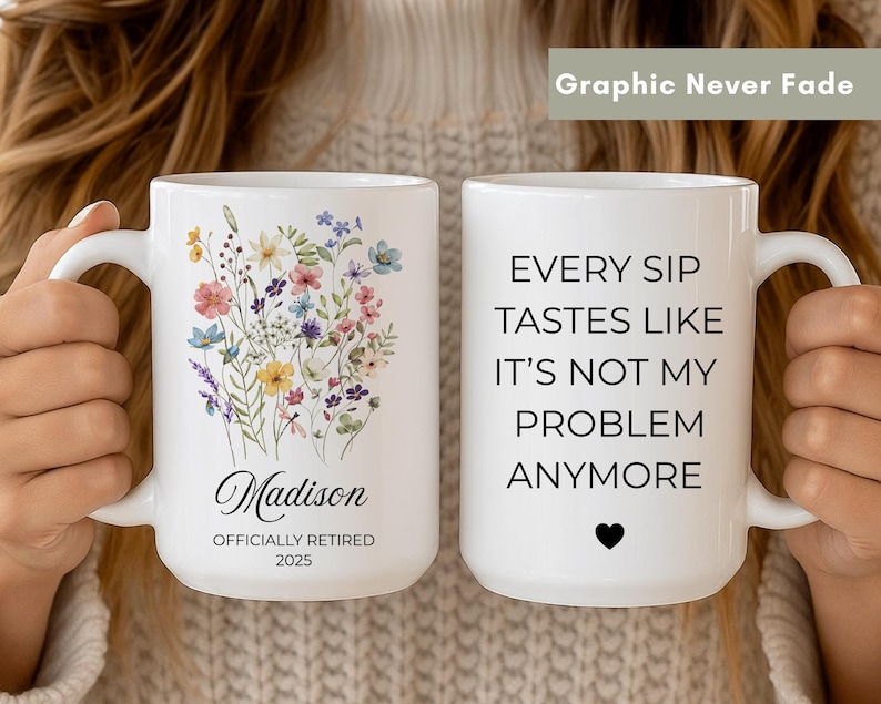 white ceramic mug with floral design and text “officially retired 2025” on one side, and funny quote about retirement on the other side