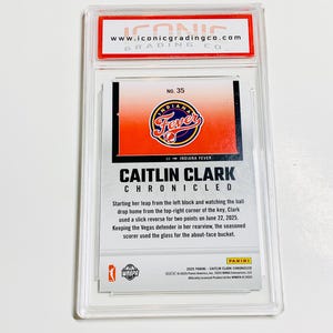 May include: A Caitlin Clark Chronicles trading card, encased in a protective holder. The card features the Indiana Fever logo and a description of a play. The card is graded by Iconic Grading Co.
