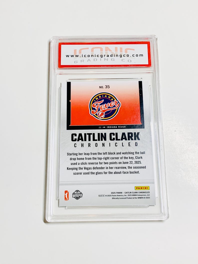 May include: A Caitlin Clark Chronicles trading card, encased in a protective holder. The card features the Indiana Fever logo and a description of a play. The card is graded by Iconic Grading Co.