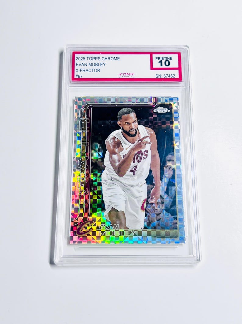 May include: A 2025 Topps Chrome Evan Mobley X-Fractor basketball card, graded Pristine 10, encased in a clear protective holder. The card features a player in a white jersey with the number 4. The card's serial number is 67462.
