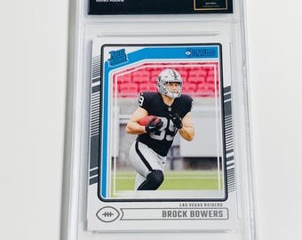 GRADED 10 BROCK BOWERS Rookie Card 2024 Donruss Rated Rookie #394 Las Vegas Raiders Gem Mint