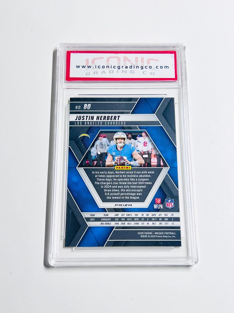 May include: A graded Justin Herbert Los Angeles Chargers football card. The card features a blue and silver mosaic design with player stats and the Panini Prizm logo. The card is encased in a clear protective holder.