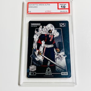 Peut inclure: Carte &agrave; collectionner de la s&eacute;rie 2024 Battle Arena Alpha, repr&eacute;sentant un personnage encapuchonn&eacute; avec une &eacute;p&eacute;e. La carte est not&eacute;e Pristine 10 et est intitul&eacute;e "Shrouded" avec le num&eacute;ro 7. La carte est dans un &eacute;tui de protection.
