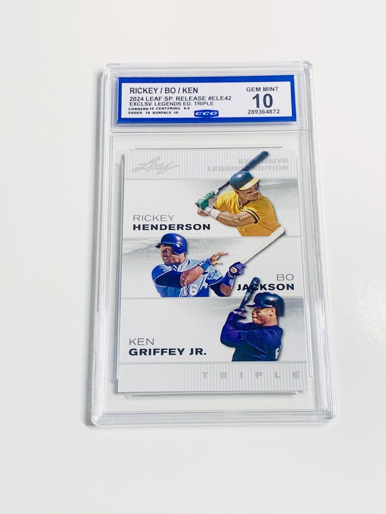 May include: A baseball card featuring Rickey Henderson, Bo Jackson, and Ken Griffey Jr. The card is graded GEM MINT 10 and encased in a protective holder. The card is from the 2024 Leaf SP. Release #ELE42 Exclusive Legends Edition Triple.