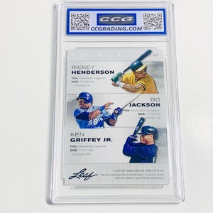 May include: A baseball trading card encased in a clear protective holder. The card features images of Rickey Henderson, Bo Jackson, and Ken Griffey Jr. The card is labeled "Leaf" and includes the CCG grading logo.
