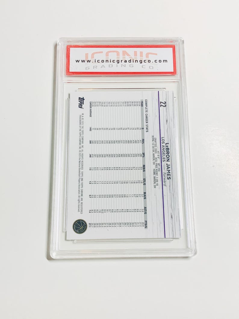 May include: A Topps LeBron James basketball card, graded and encased by Iconic Grading Co. The card features career stats and the player's information. The card is in a clear plastic case with a red and white label.