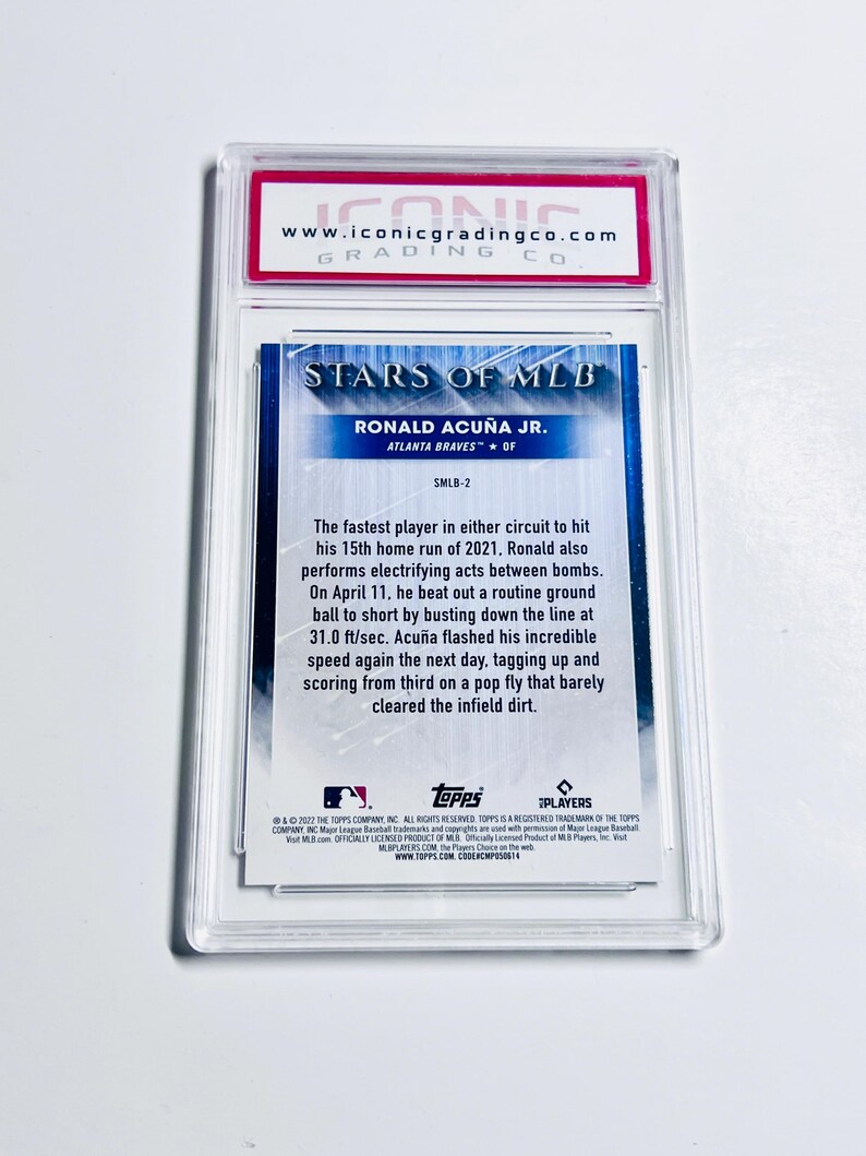 May include: A baseball card featuring Ronald Acu&ntilde;a Jr. of the Atlanta Braves, graded by Iconic Grading Co. The card is encased in a clear protective holder. The card's design includes the text "STARS OF MLB".