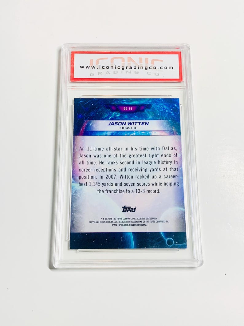 May include: A graded Jason Witten football card in a clear protective case. The card features a blue and purple background with the player's name and team. The top of the case has a red and white label with the Iconic Grading Co. logo.