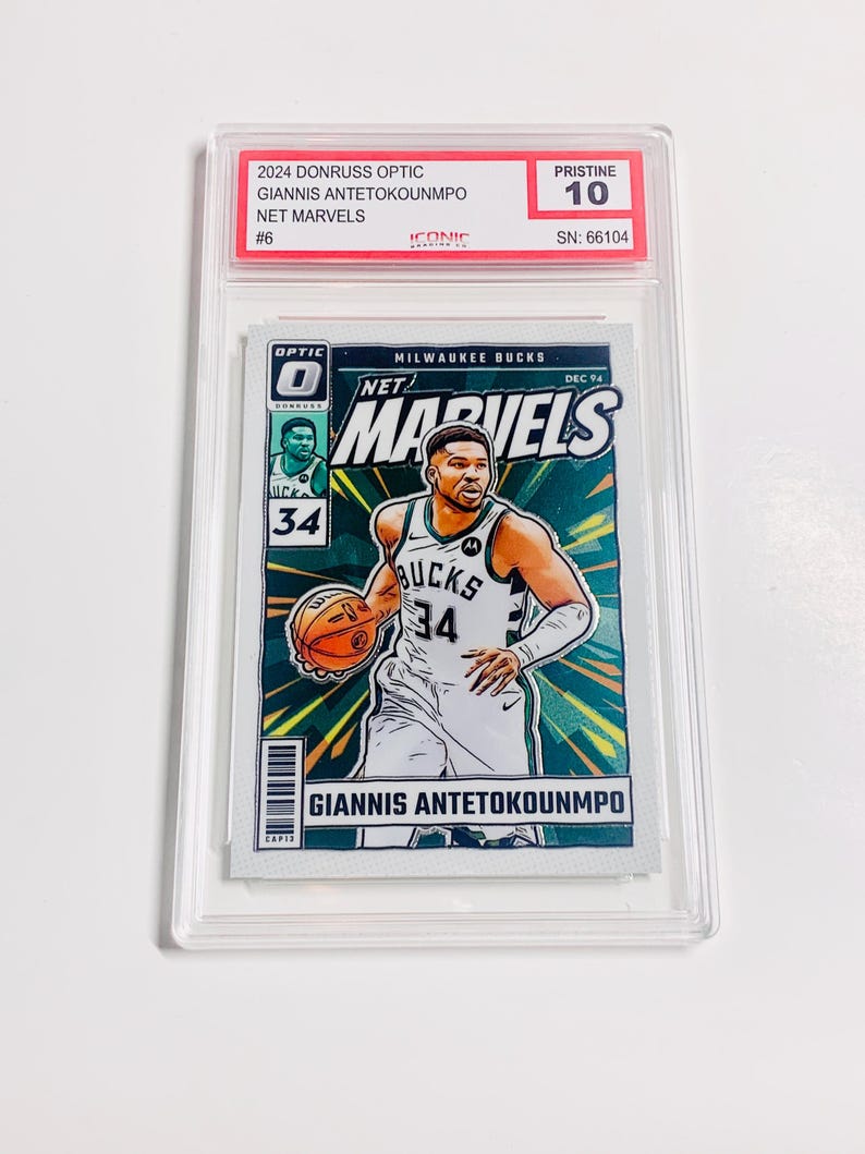 May include: A basketball trading card featuring Giannis Antetokounmpo in a Milwaukee Bucks uniform. The card is from the 2024 Donruss Optic Net Marvels series, graded Pristine 10. The card has a vibrant design with the player's name and team details.
