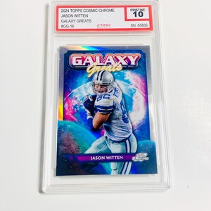 May include: A 2024 Topps Cosmic Chrome trading card featuring Jason Witten from the Galaxy Greats series. The card is encased in a protective holder and graded Pristine 10. The card has a colorful galaxy background.