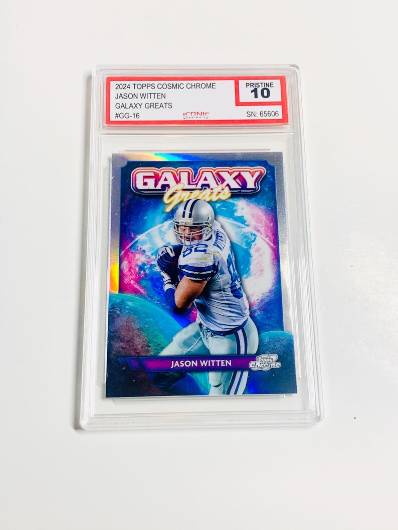 May include: A 2024 Topps Cosmic Chrome trading card featuring Jason Witten from the Galaxy Greats series. The card is encased in a protective holder and graded Pristine 10. The card has a colorful galaxy background.