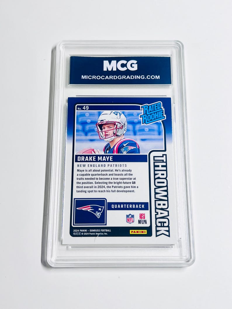 May include: A graded football card featuring Drake Maye of the New England Patriots. The card is encased in a clear protective holder and includes the text "THROWBACK" and "RATED ROOKIE". The card also has the text "MCG MICROCARDGRADING.COM".