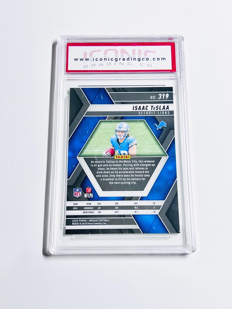 May include: A graded Isaac TeSlaa Detroit Lions football card. The card features a photo of the player in a blue uniform. The card is encased in a clear plastic holder with the Iconic Grading Co. logo.
