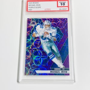 May include: A Michael Irvin football card from the 2025 Mosaic set, featuring a purple scope design. The card is graded Pristine 10 and encased in a protective holder. The card has the text "MICHAEL IRVIN" and "COWBOYS #88".