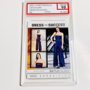 May include: A Caitlin Clark trading card from the 2025 Panini Chronicles series. The card features images of Clark in a strapless jumpsuit. The card is graded Pristine 10 and includes the text "Dress for Success".