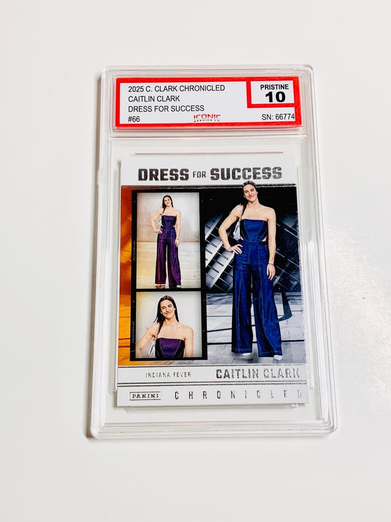 May include: A Caitlin Clark trading card from the 2025 Panini Chronicles series. The card features images of Clark in a strapless jumpsuit. The card is graded Pristine 10 and includes the text "Dress for Success".